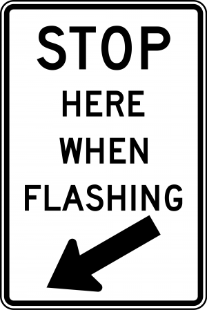R8-10 Stop Here When Flashing Regulatory Sign