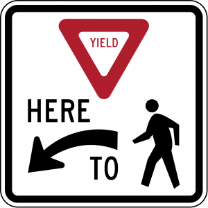 R1-5L Yield Here To Pedestrians Regulatory Sign